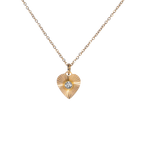 Gold necklace with a heart-shaped pendant