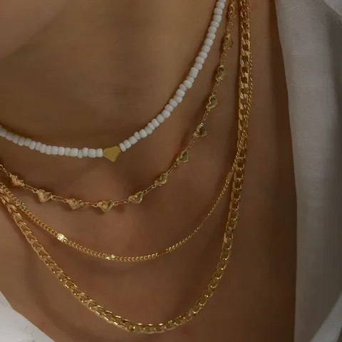 4-Piece Gold Layering Necklace Set – Hearts & Cubans