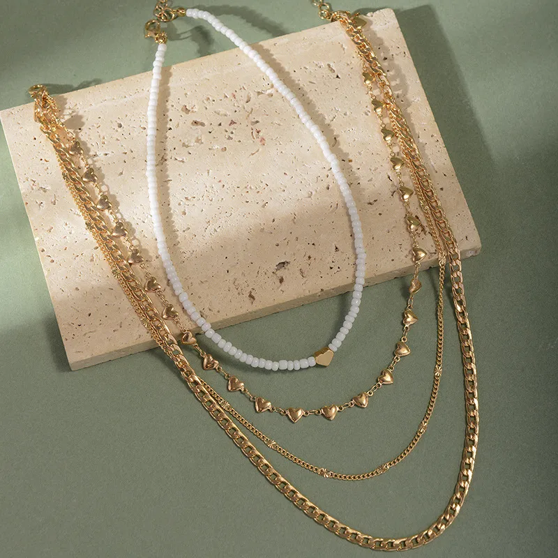 4-Piece Gold Layering Necklace Set – Hearts & Cubans