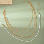 4-Piece Gold Layering Necklace Set – Hearts & Cubans