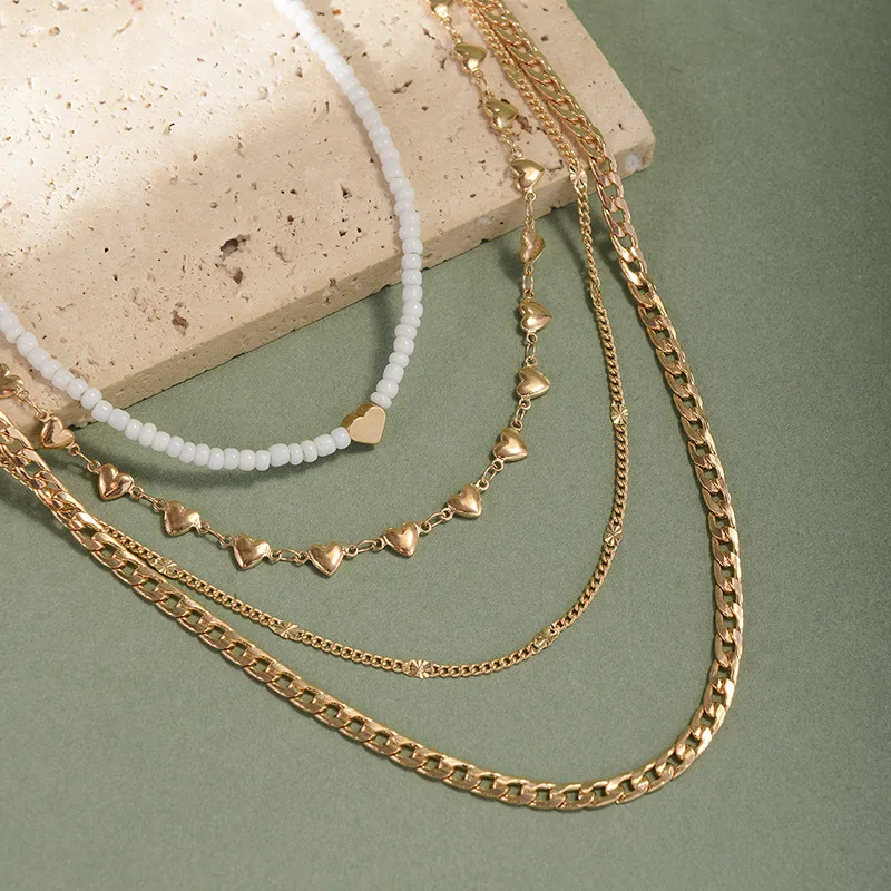 4-Piece Gold Layering Necklace Set – Hearts & Cubans